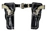 Decorated leather holsters with belt. Includes two die-cast repeater cap pistols.